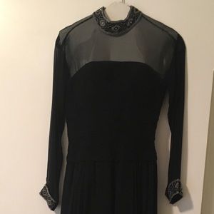 Long sheer sleeve ball gown